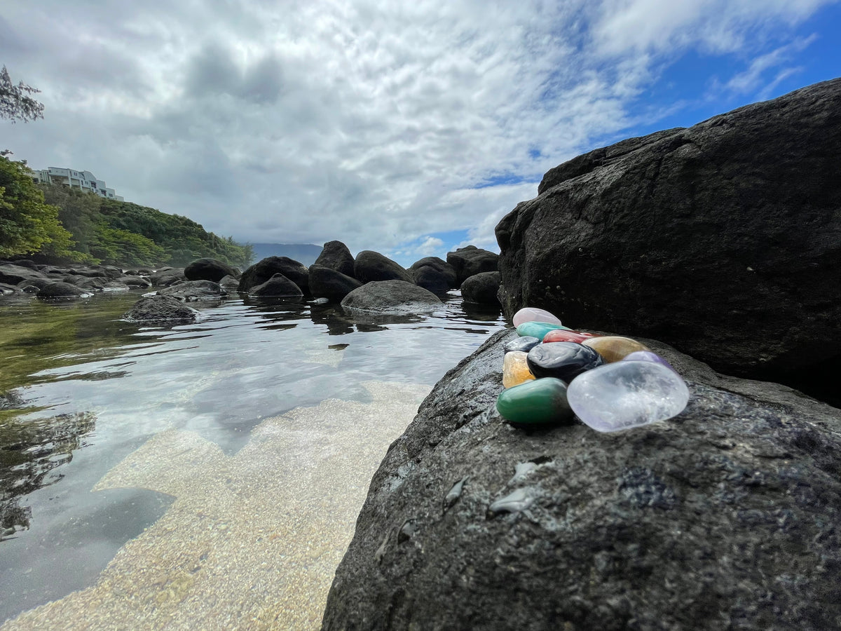 gemstones on a rock by the ocean to cleanse  and energize