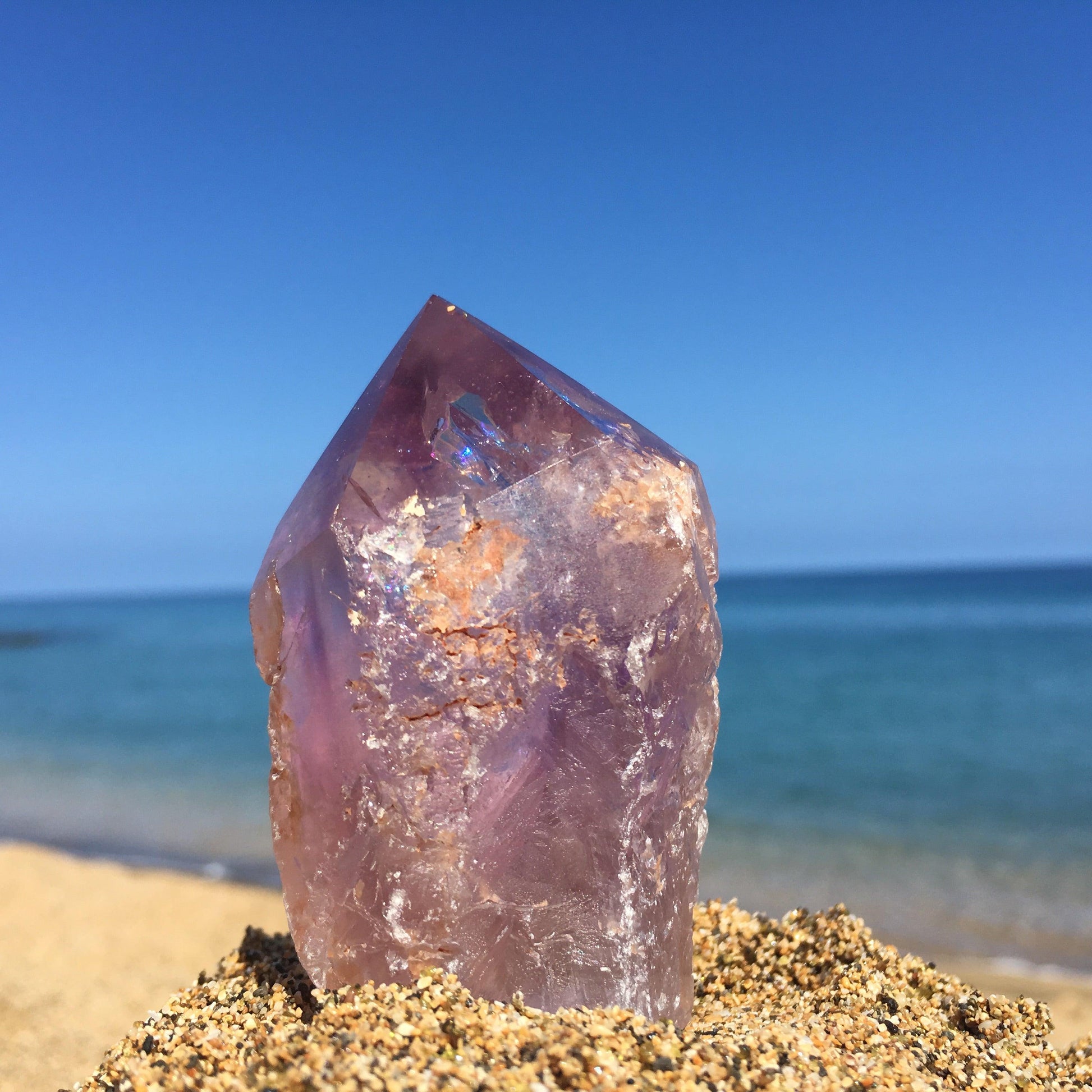 Amethyst point with rainbow